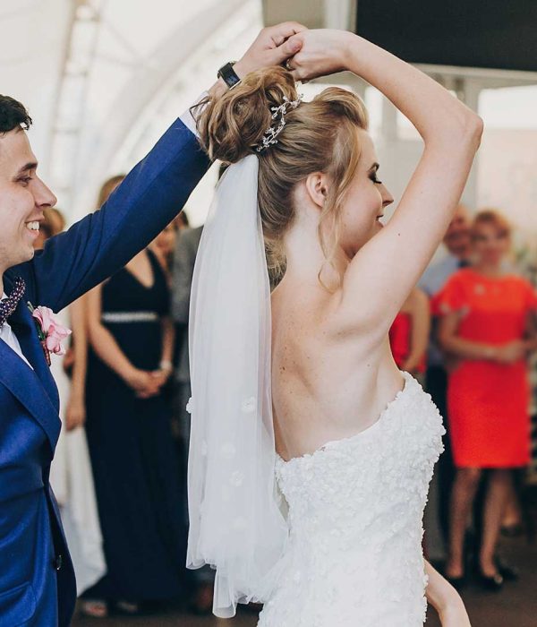 stylish-happy-bride-and-groom-gently-dancing-at-we-DKH3DPP.jpg
